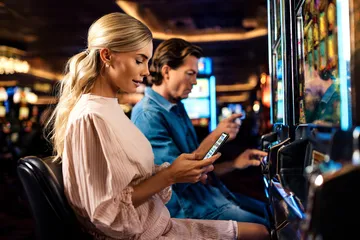 A cheerful woman in traditional clothing using her smartphone during a festive moment, showing how easily the GEMJLL app fits into everyday life.