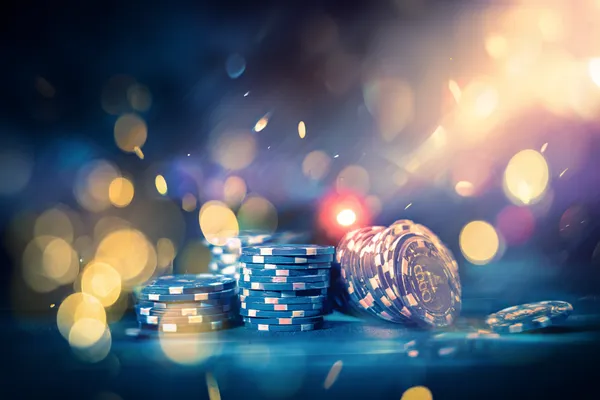 A glamorous woman holding casino chips in a neon-lit environment, representing the premium online casino atmosphere of GEMJLL.
