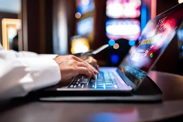 A woman smiling by bright slot machines showing lucky symbols, showcasing the exciting slot offerings at GEMJLL.